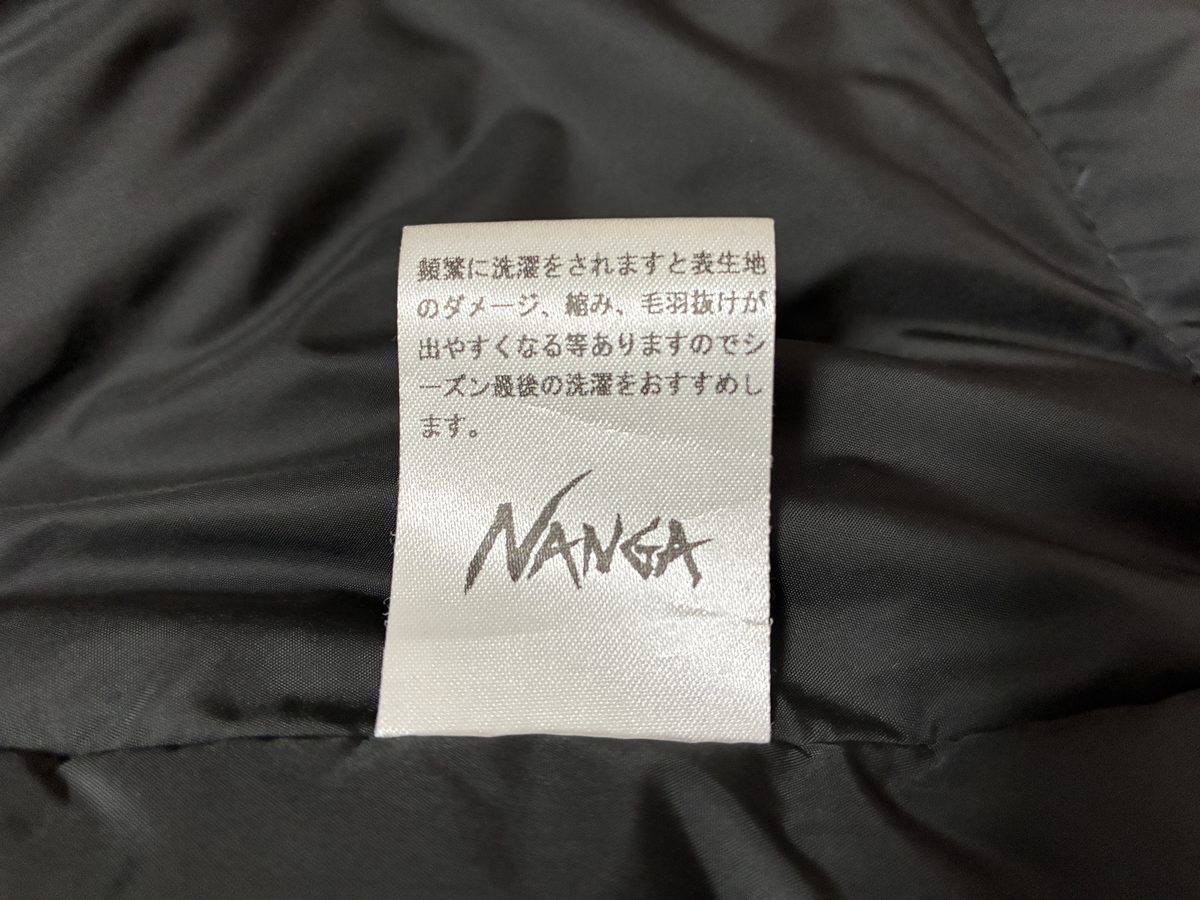 TAKIBIダウンコート内側のNANGAケアタグ シーズン最後の洗濯をおすすめする注意書き